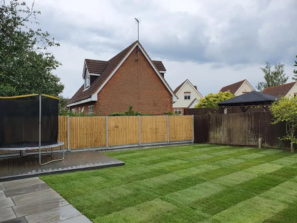 New timber garden fencing installed beside a landscaped lawn