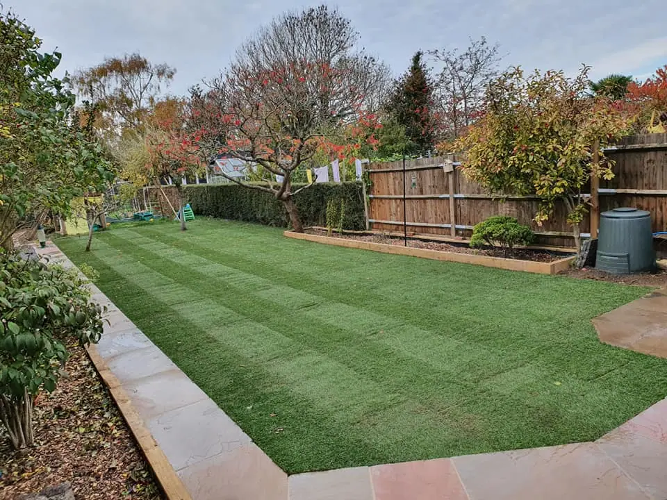 Timber fencing running along the edge of a landscaped garden